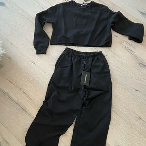 PRETTYLITTLETHING black crop sweater and matching sweatpants.